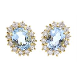 Pair of 18ct gold aquamarine and diamond cluster stud earrings, hallmarked, total aquamarine weight approx 2.10 carat, total diamond weight approx 1.10 carat