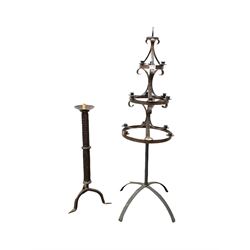 20th century scrolled wrought metal three tier candelabra, (H128cm) together with a wrought metal floor standing candle stick H80cm