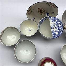 18th/ 19th English porcelain tea bowls and saucers including Newhall and Lowestoft examples, a maroon ground tea bowl finely painted with floral sprays together with a Copeland & Garrett feeding cup 