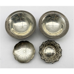 Pair of Edwardian silver circular sweetmeat dishes with bead edge decoration initialled 'A' on pedestal foot D11cm Sheffield 1908 Maker James Dixon & Sons another sweetmeat dish and a saucer dish by Roberts & Belk 8.5oz 