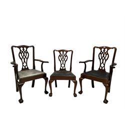 Set six (2+4) Chippendale style dining chairs, the shaped cresting rail over pierced splat over drop in seat pads, raised on ball and claw supports  