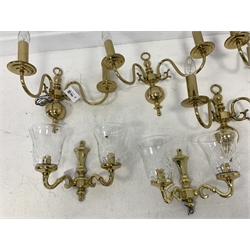 Set of three modern brass two branch wall lights with glass shades, height of backplate 20cm, and a set of four brass two branch wall lights