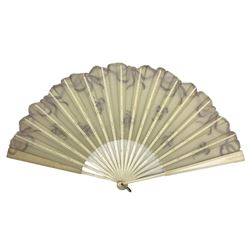 Early 20th century fan, the cream gauze leaf supported with bone ribs and guard, the gauze painted with lilac ribbons and sprigs, W67cm, Guard 35cm