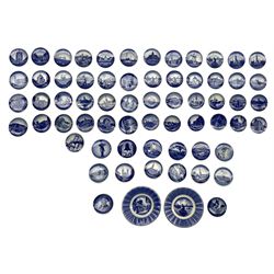 Part set of fifty-six Royal Copenhagen  Aluminia, Faience circular pin dishes or plaques, mostly depicting Dutch buildings, together with other similar blue and white dishes D8cm, together with two other similar plates (65)