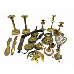 18th century brass candlestick H20cm, other candlesticks, horse brasses on leather straps, various loose brasses etc