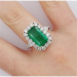 18ct white gold emerald and round brilliant cut diamond cluster ring, stamped 18K, emerald approx 3.70 carat, total diamond weight approx 1.20 carat