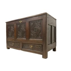 18th century oak mule chest, rectangular hinged top with moulded edge, the three fielded panel front carved with lozenges and foliate motifs, the two drawers to the base heavily carved with gadroon decoration, on stile supports