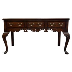 Georgian design oak dresser base, the rectangular crossbanded top and three frieze drawers over shaped and pierced apron, raised on cabriole supports 