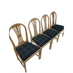 Set of eight bleached walnut Edwardian dining chairs, the carved cresting rail and pierced splat over drop in seat pad, raised on turned supports