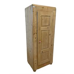 20th century single pine wardrobe, fitted with one hanging rail and drawer, raised on turned bun feet 