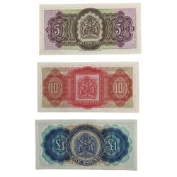 Three Queen Elizabeth II Bermuda Government banknotes, comprising five shillings '1st May 1957 D2 779804', ten shillings '1st October 1966 WI 014546' and one pound '1st October 1966 X2 587101'
