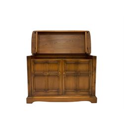 Ercol - hi fi cabinet, with hinged lifting lid over two cupboard doors