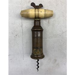 Victorian brass Thomason type double action corkscrew with turned bone handle, 19th century Sheffield plate wine coaster, cold painted spelter dog mounted on later brass ashtray base and a silvered model of a Lion (4)