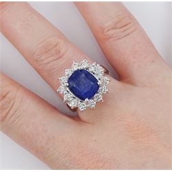 18ct white gold sapphire and round brilliant cut diamond cluster ring, stamped, sapphire approx 6.20 carat, total diamond weight approx 0.85 carat