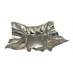 Novelty silver dish by Rebecca Joselyn modelled as a crumpled crisp packet 16cm x 14cm, hallmarked Sheffield 2013. Rebecca Joselyn studied at Sheffield Hallam University and graduated in 2006. She has won numerous awards for her 'From the Shed' and 'Packaging' collections