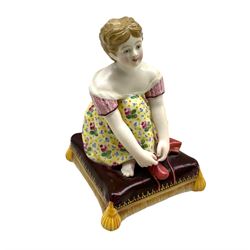 Minton porcelain figure of a girl tying her shoe lace, unmarked H9.5cm, 