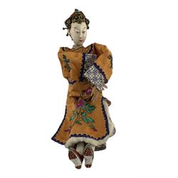 Two early to mid 20th century Chinese Opera dolls, each with painted composition heads and embroidered robes, together with another Chinese doll and hat 
