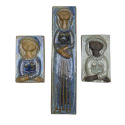 Marianne Starck for Michael Andersen & Son, Bornholm, three glazed stoneware  rectangular wall plaques, each decorated with a single lady, each impressed and numbered 5841 and 5843, L36cm max (3)
