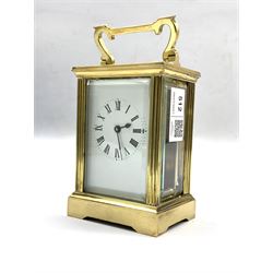 20th century French brass carriage time piece clock, with bevel glazed panels, white enamel dial with Roman chapter ring W8cm