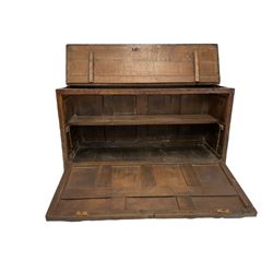 18th century and later oak coffer, the hinged lifting lid over fall front, opening  to reveal one shelf, raised on stile supports 