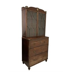 George III mahogany secretaire bookcase, the cornice with brass lion mask over two glazed doors of tracery design, opening to reveal two adjustable shelves over fall front drawer fitted for writing and two long drawers, raised on turned supports 