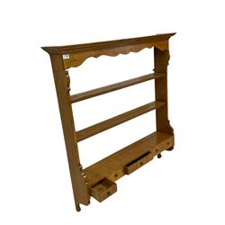Georgian design oak wall rack with two tiers and fitted with five drawers