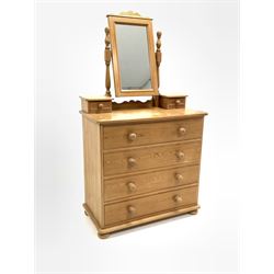 Solid pine four drawer chest, raised on turned supports, with a swing dressing mirror fitted with two trinket drawers, W89cm