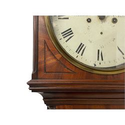 William Anderson of St Andrews – 8-day mahogany drumhead longcase clock c1840, break arch hood surmounted with scroll shaped pediment and a brass ball and eagle finial, wooden dial surround with canted reeded corners and recessed panels, trunk with recessed reeded pilasters to the corners, inlaid with yew and satinwood inlay, shoulder topped trunk door with inlay to the edge, conforming plinth with an applied decorative skirting, circular 12” painted dial with Roman numerals and minute track, subsidiary date and seconds dials, steel moon hands and brass cast bezel with a convex glass, anchor escapement with a rack striking movement, striking the hours on a bell. With weights, pendulum and key.
William Anderson is recorded as working in South Street, St Andrews (Scotland) 1832-67. Succeeded by his son George 1860-92.
