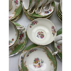 1950s Paragon Rockingham dinner and tea service comprising eight dinner plates, twelve side plates, seventeen teacups & eighteen saucers in varying sizes, sandwich plate, teapot, two sugar bowls, two milk jugs, nine soup bowls, ten saucers and thirty-five tea plates, of varying size