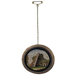 19th century Italian micromosiac brooch depicting the Cestia Pyramid, in black onyx oval setting, mounted in 9ct rose gold with ropetwist wirework, 3.9cm x 3.4cm  