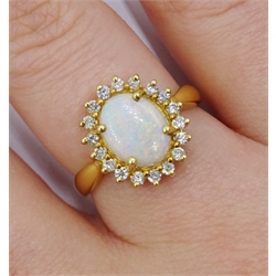 18ct gold opal and diamond cluster ring, hallmarked,  retailed by Jill Freeman, in original box