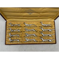'Les Animaux Modernes' a set of twelve early 20th century French silvered-bronze knife rests cast as three Foxes, three Hares, pair of Dachshunds, pair of Terriers, a Duck and Pheasant, mostly stamped C.O.P 18gr & Depose, box marked 'Les Animaux Modernes', Porte Couteaux Bronze veritable Ciselé & Argenté, Modeles Deposé 


