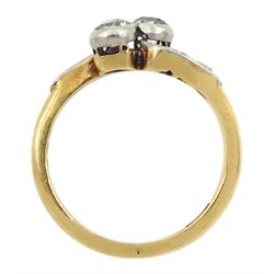 Early 20th century two stone old cut diamond crossover ring, with diamond set shoulders, stamped 18ct, total diamond weight approx 0.40 carat