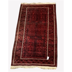 Red afghan rug, with six panels on red field, geometric decoration to border, 204cm x 113cm
