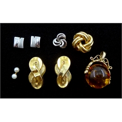 Two pairs of gold stud earrings, gold amber swivel pendant and three single stud earrings, all 9ct stamped or hallmarked