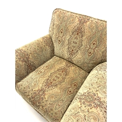Parker Knoll Burghley armchair upholstered in Baslow Medalli Gold fabric, raised on turned front supports and brass castors, W103cm