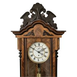 German - late 19th century 8-day walnut and ebony Vienna regulator, pediment with carved decoration and turned pendant finials, fully glazed case door and side panels, two-part enamel dial with roman numerals and seconds dial, single train timepiece movement with weight, pulley and pendulum. With key. 