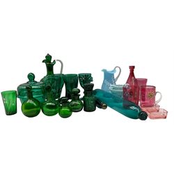 Victorian blue facet cut glass double ended scent flask, green glass claret jug with enamelled decoration, Mary Gregory style cranberry glass vase and other coloured glass items