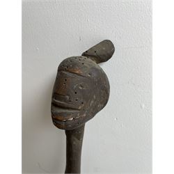  Zulu knobkerry the finial carved as a head and with twisted stem L127cm and four other Zulu knobkerries (5)