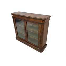 Victorian figured walnut pier cabinet, rectangular top with moulded edges over banded frieze inlaid with satinwood foliate decoration, fitted with two glazed doors enclosing two shelves with satinwood stringing, on plinth base