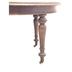 Victorian mahogany wind out extending dining table, the oval top with moulded edge, raised on turned supports with brass and ceramic castors, three additional leaves 225cm x 111cm, H77cm (extended)