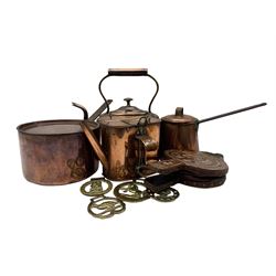 Copper items to include pan with lid stamped with crown mark, milk pan with lid, kettle, bellows decorated with seahorses, Joyman & Co of Brighton watering can together with horse brass max H29cm