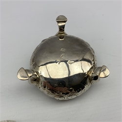George III silver navette shape mustard pot with engraved and pierced sides and initialled 'WJW' with blue glass liner London 1791 Maker possibly Thomas Streetin and a pair of George III embossed silver circular salts, marks rubbed but possibly London 1790