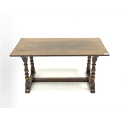 20th century solid oak coffee table, rectangular top raised on four turned supports terminating in sledge feet united by stretcher