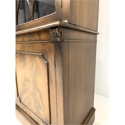 Bevan Funnell Reprodux Georgian style mahogany concave front bookcase, with dentil cornice over frieze with aplied acanthus carved corbels, three tracery glazed doors each enclosing three fixed shelves, three fielded cupboards under