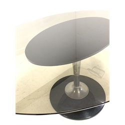 Mid century Chromcraft dining table, the oval smoked glass top raised on a tulip form stainless steel and Lucite base (153cm x 118cm, H73cm) with a set of four matching Chromcraft dining chairs, with Lucite back rests, upholstered seats, raised on stainless steel four point swivel bases (W45cm)