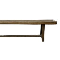 Large 19th century oak bench or pew, rectangular canted top, raised on trapezoid end supports united by stretcher