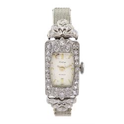 Art Deco ladies platinum diamond set wristwatch, the rectangular bezel and articulated lugs, milgrain set with old cut diamonds, manual wind 17 jewel movement by Perona, on adjustable 9ct white gold bracelet, makers marks J G & S