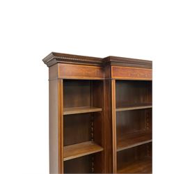 Georgian design inlaid mahogany breakfront open bookcase, projecting dentil cornice over frieze with satinwood banding and bellflower festoon inlays, with adjustable shelves, on skirted base