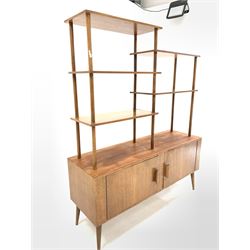 Mid 20th century teak sideboard etagere, with five open shelves on turned supports over base fitted with two doors, raised on turned tapered and splayed supports W122cm, H150cm, D38cm
